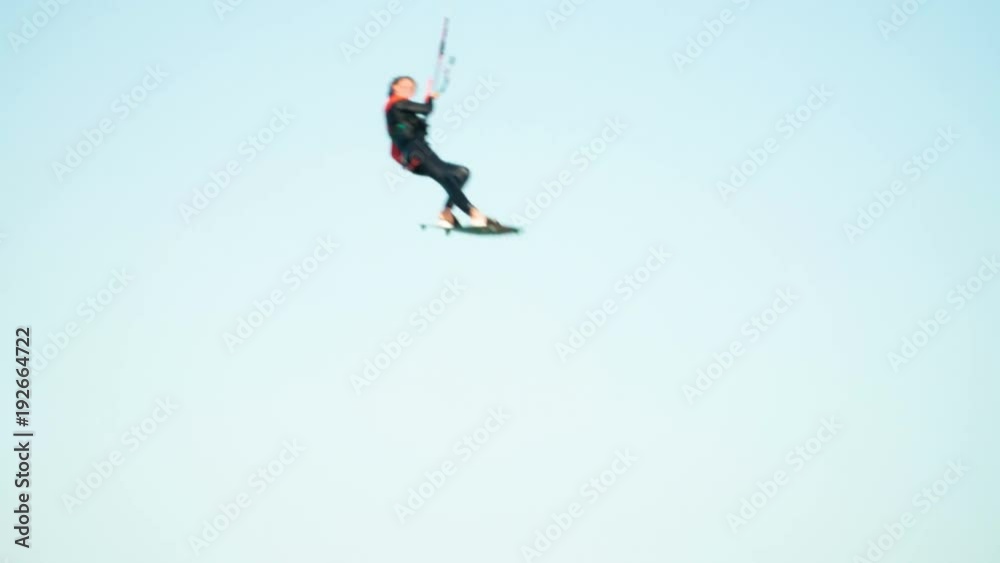 Man Kitesurfing In Ocean In Summer Does Extreme Trick Man Kitesurfing In Ocean In Summer Does Extreme Trick