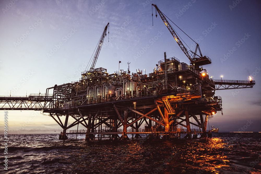 oil rig at sunset with beautiful lights Stock Photo | Adobe Stock