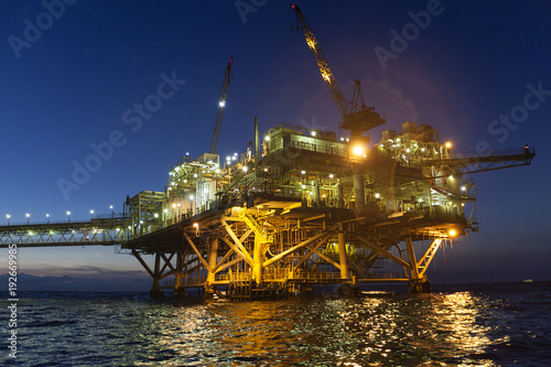 oil rig at sunset with beautiful lights