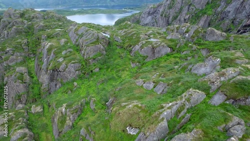 Fly above Trollfjord, Norway (aerial footage )  The amazingly narrow Trollfjord is a 2 km long sidearm of the Raftsund  photo