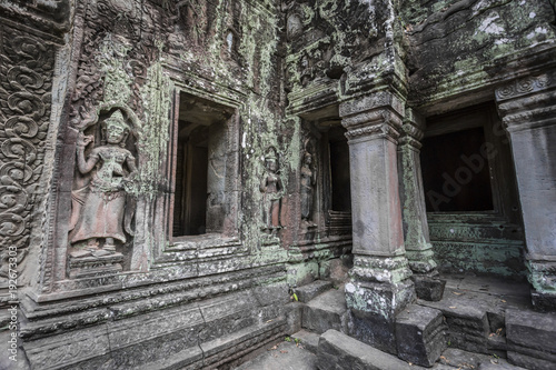Siem Reap Angkor Wat apsara dancer ancient stone carving on wall and pillar