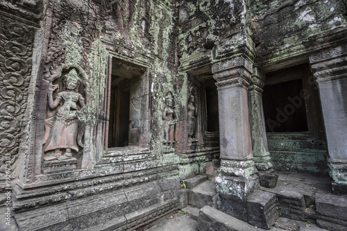 Siem Reap Angkor Wat apsara dancer ancient stone carving on wall and pillar © Jeffery