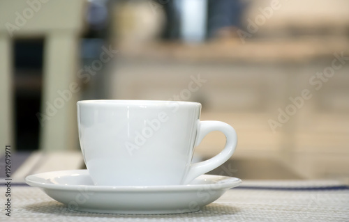white cup of coffee on a table