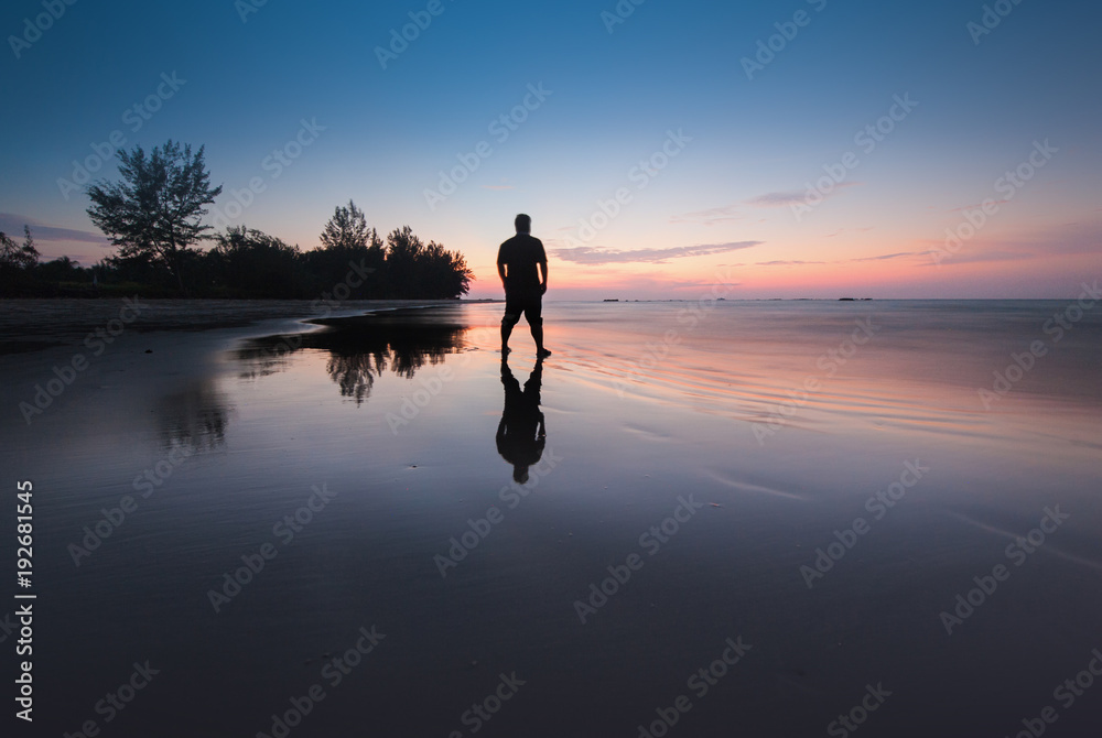 blue hour sunset with beautiful reflection on wet sand.