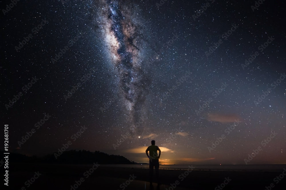 milkyway galaxy rise above lone tree at Kudat, Sabah Malaysia. Image contain soft focus, blur and noise due to long expose and high iso. Long expose and high iso setting need in night photo. 