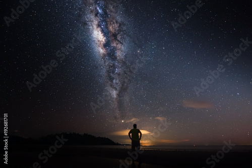 milkyway galaxy rise above lone tree at Kudat, Sabah Malaysia. Image contain soft focus, blur and noise due to long expose and high iso. Long expose and high iso setting need in night photo. 