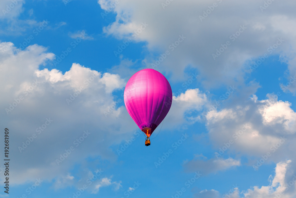 Fototapeta premium purple hot air balloons flying in blue sky with clouds