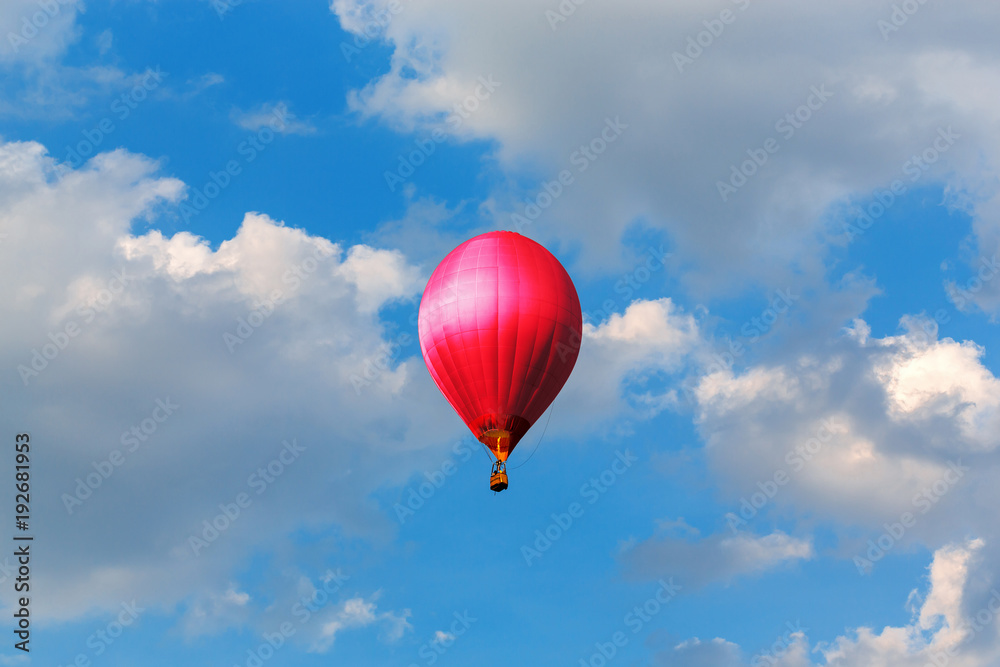 Naklejka premium red hot air balloons flying in blue sky with clouds