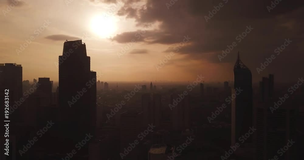 Jakarta city skyline on cloudy dusk Jakarta city skyline on cloudy dusk