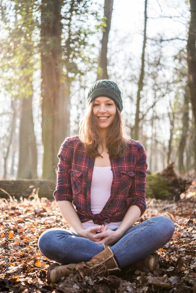 Woman sitting in forest and feel the nature Woman sitting in forest and feel the nature
