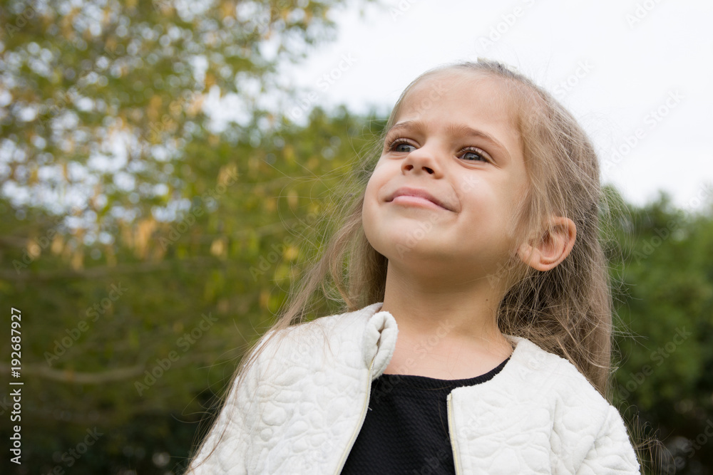 cute little blond girl in park emotional face cute little blond girl in park emotional face