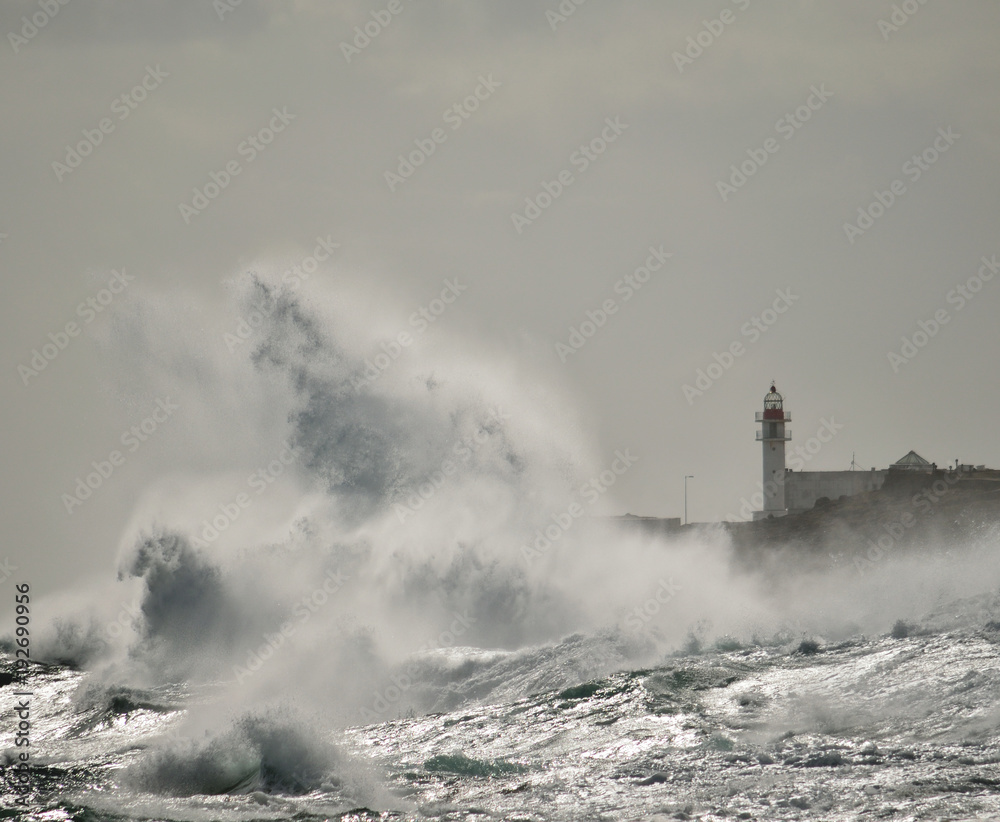 Big waves and lighthouse, coast of Taliarte, Gran canaria, Canary islands