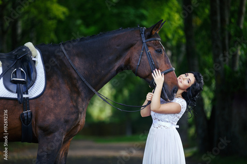 beautiful girl in dress with horse