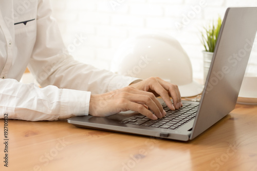 Business man working document and engineer at office.