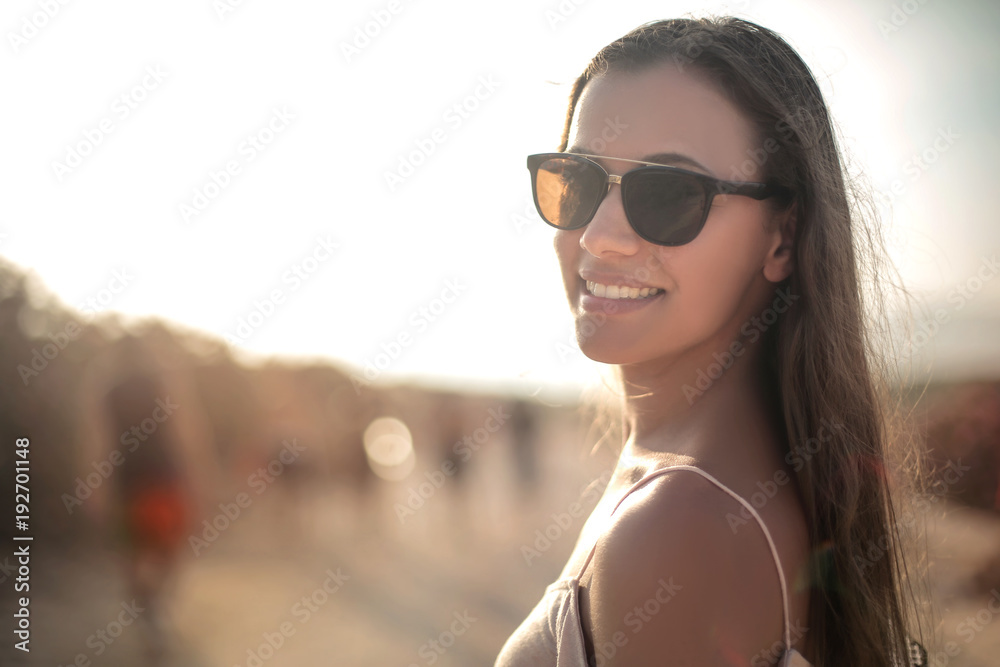 Smiling girl wearing sunglasses Smiling girl wearing sunglasses