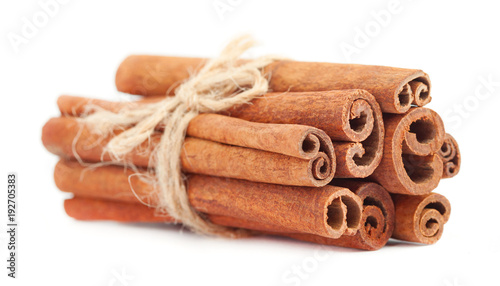 Fragrant dry cinnamon sticks isolated on white background. Cinnamon stick spice isolated on white background. Closeup