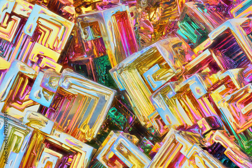 Amazing colorful rainbow Bismuth Gemstone Crystals macro closeup texture as background