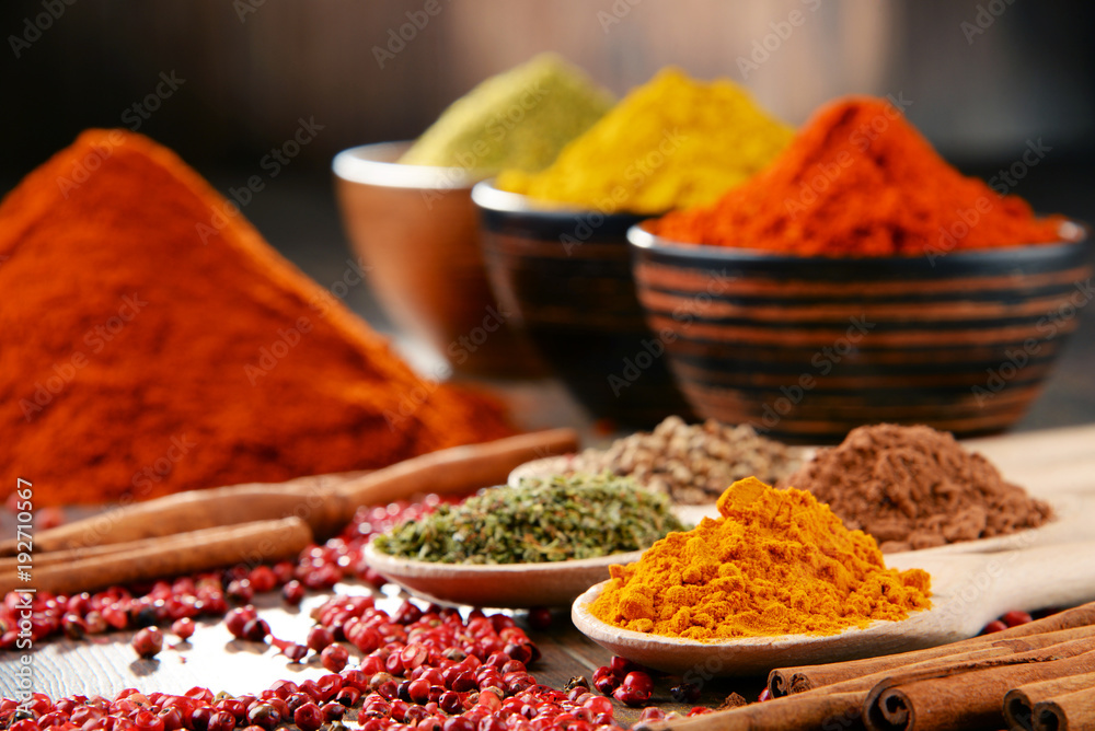 Variety of spices on kitchen table Variety of spices on kitchen table