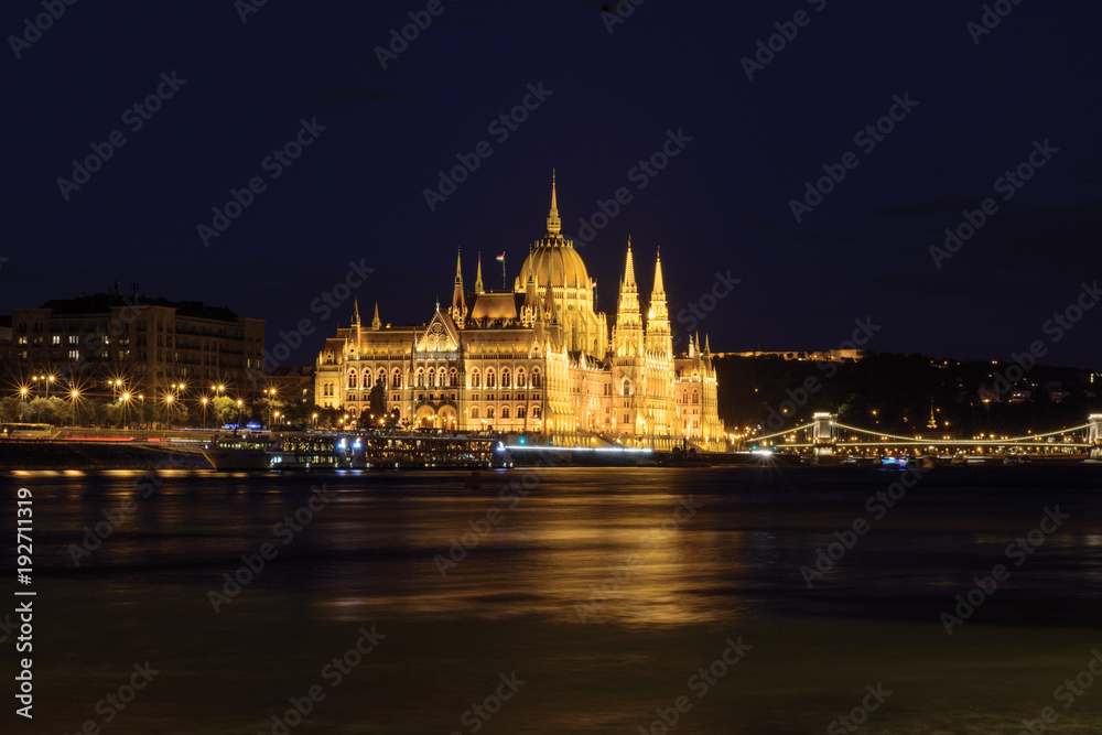 Parliament building reflecting in Danube river at night, Budapest