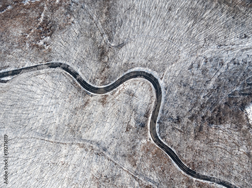 Aerial view of curvy road © Csák István