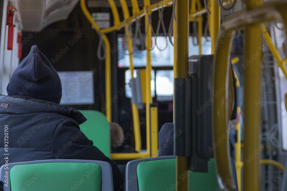 People in public transport in bad weather People in public transport in bad weather