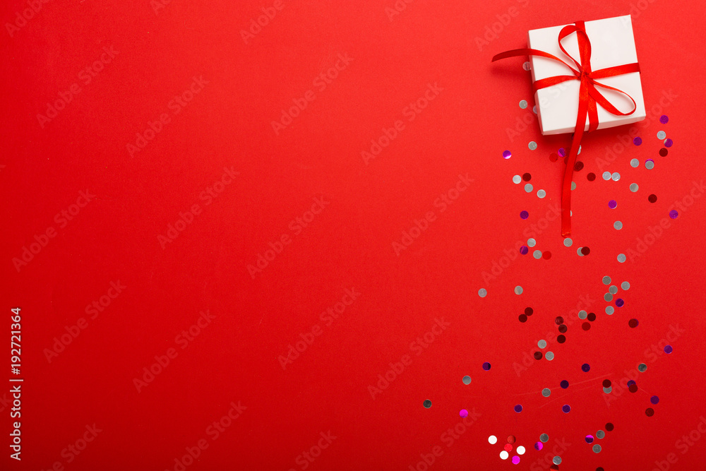 Present on a bright red background with a copy space Present on a bright red background with a copy space