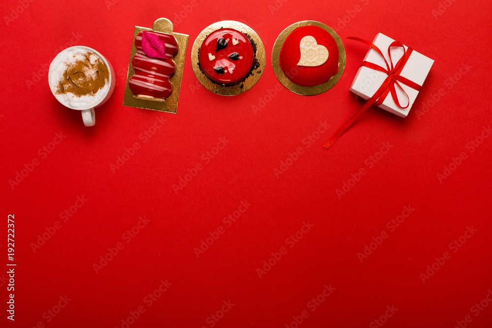 Present and deserts on a bright red background with a copy space Present and deserts on a bright red background with a copy space