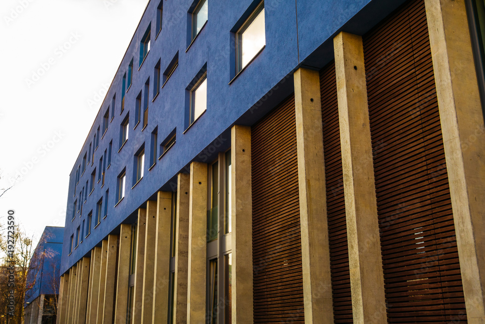 blue plattenbau facade with wooden details