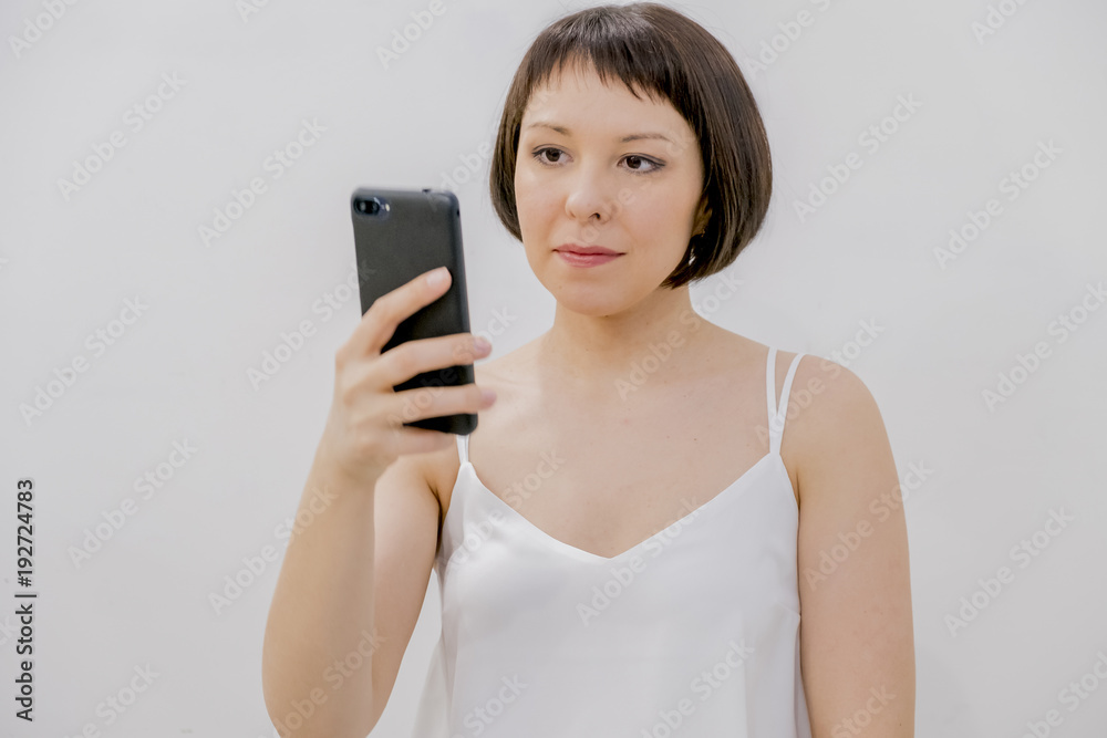 Asian woman use smartphone, writes a message on the social network Asian woman use smartphone, writes a message on the social network