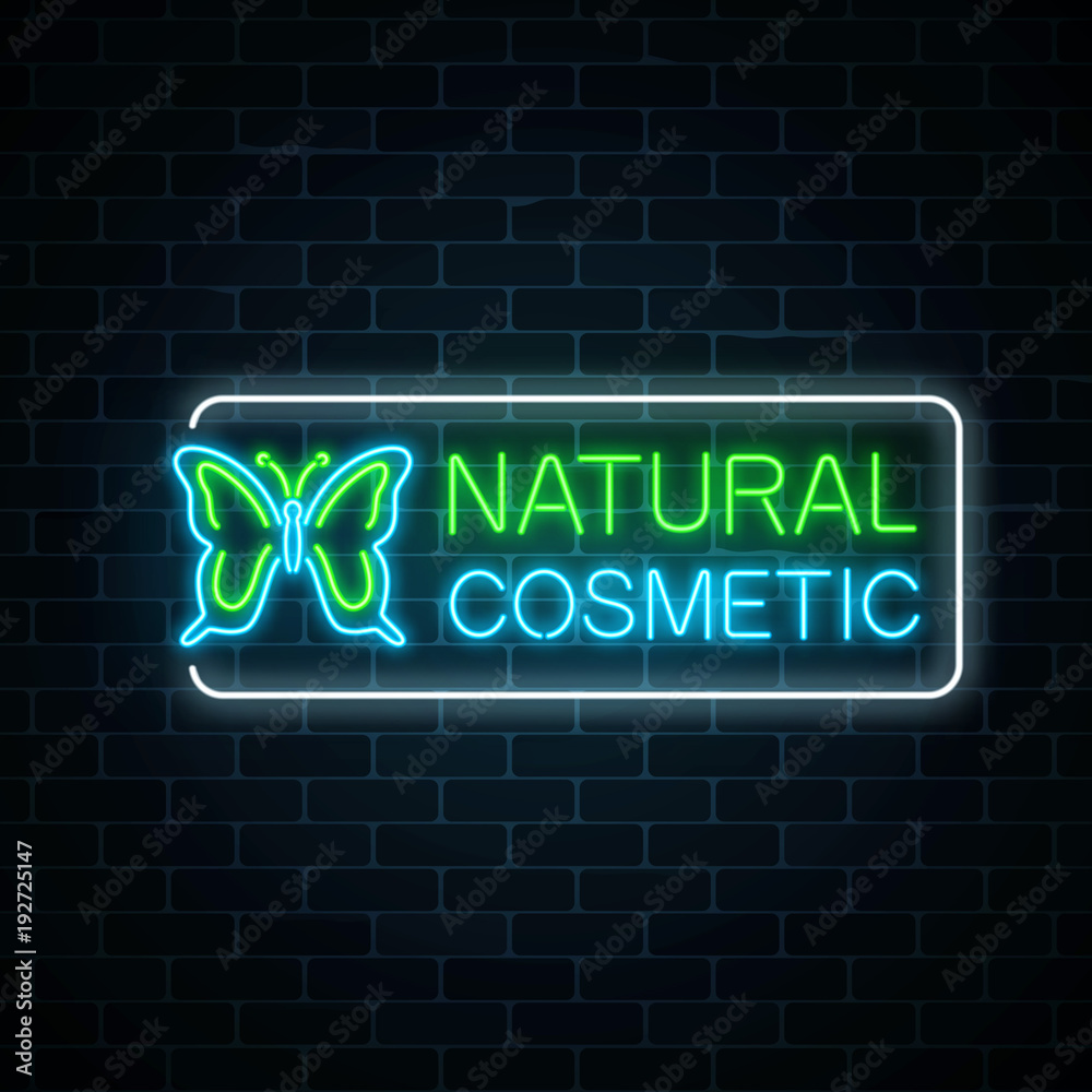 Neon sign of natural cosmetic production with butterfly on dark brick wall background. Neon sign of natural cosmetic production with butterfly on dark brick wall background.