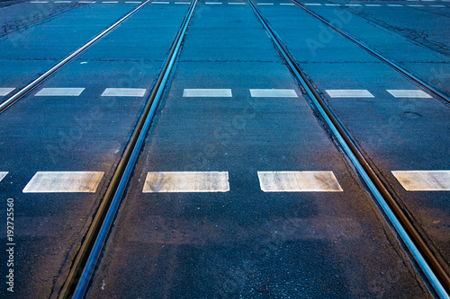 train rails on a cold colored road