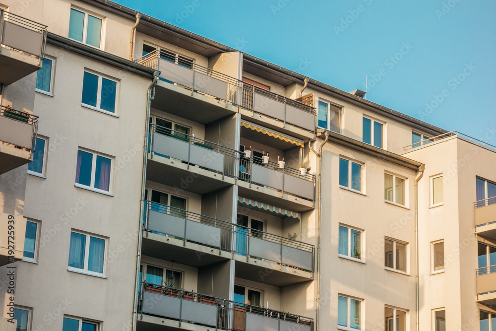 white apartment complex with grey balcony