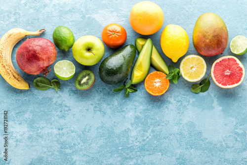 Fototapeta Naklejka Na Ścianę i Meble -  top view of different selected juicy organic tropical fruits, superfood, healthy meal concept, healthy food background