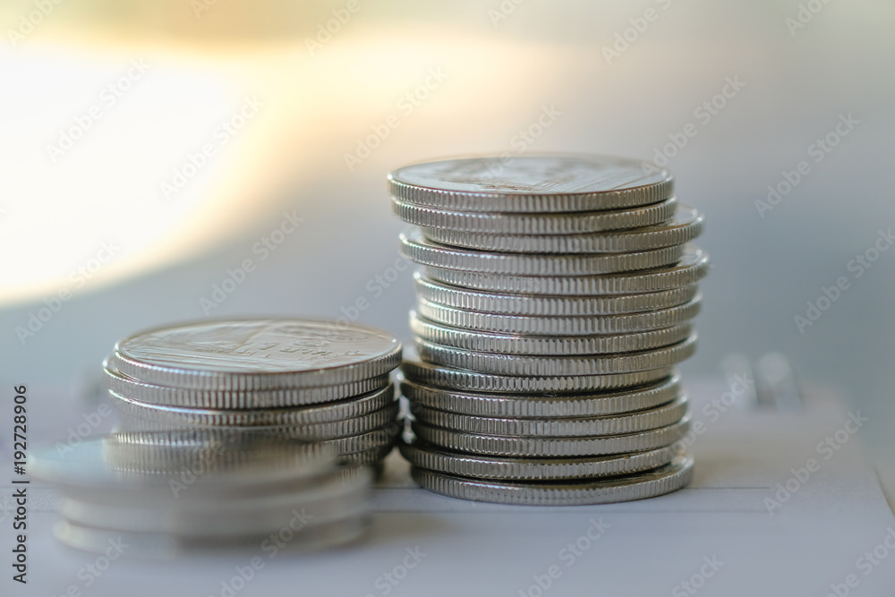 Money and Business Concpet. Stack of silver coins on notebook. Money and Business Concpet. Stack of silver coins on notebook.