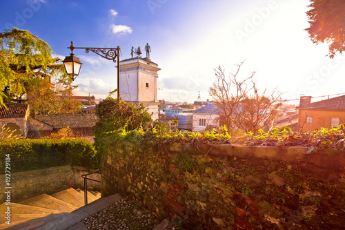 Town of Udine landmarks view with red sun haze