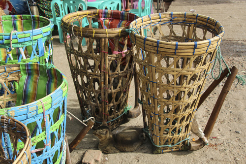 Wicker baskets for carrying weights. The traditional way of carrying weights in Myanmar (Burma)