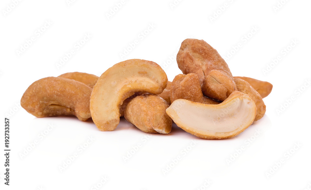 Roasted cashew nuts on white background Roasted cashew nuts on white background