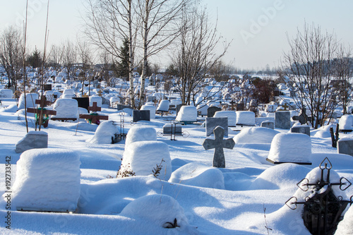 snow-covered cemetery on a frosty winter day