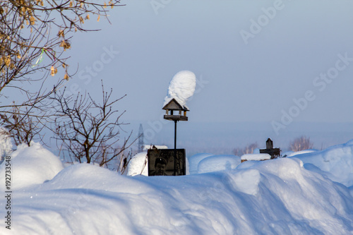 snow-covered cemetery on a frosty winter day