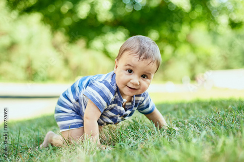 Child crawling on the grass
