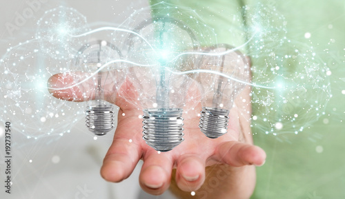 Businessman connecting modern lightbulbs with connections 3D rendering