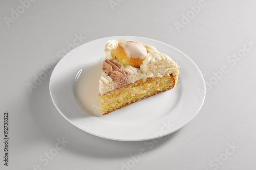Round dish with slice of saint honorè cake