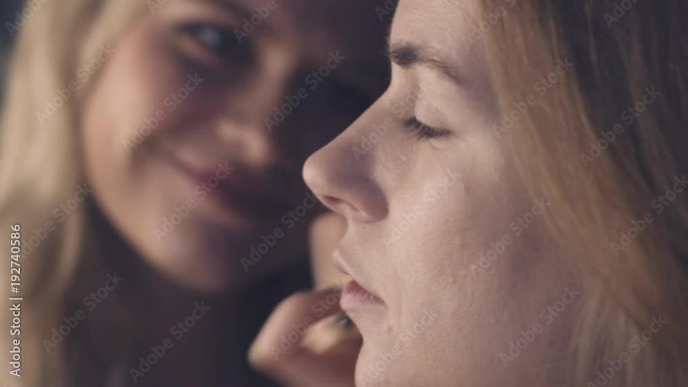 Make-up artist putting tone on model face Make-up artist putting tone on model face