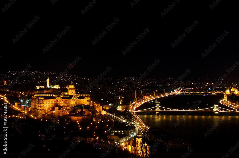 Budapest Hungarian capital evening panoramic view with floodlit Buda Castle Hill, Royal Palace, Matthias Church, River Danube banks and Szechenyi Chain Bridge from Gellert Hill Budapest Hungary Europe