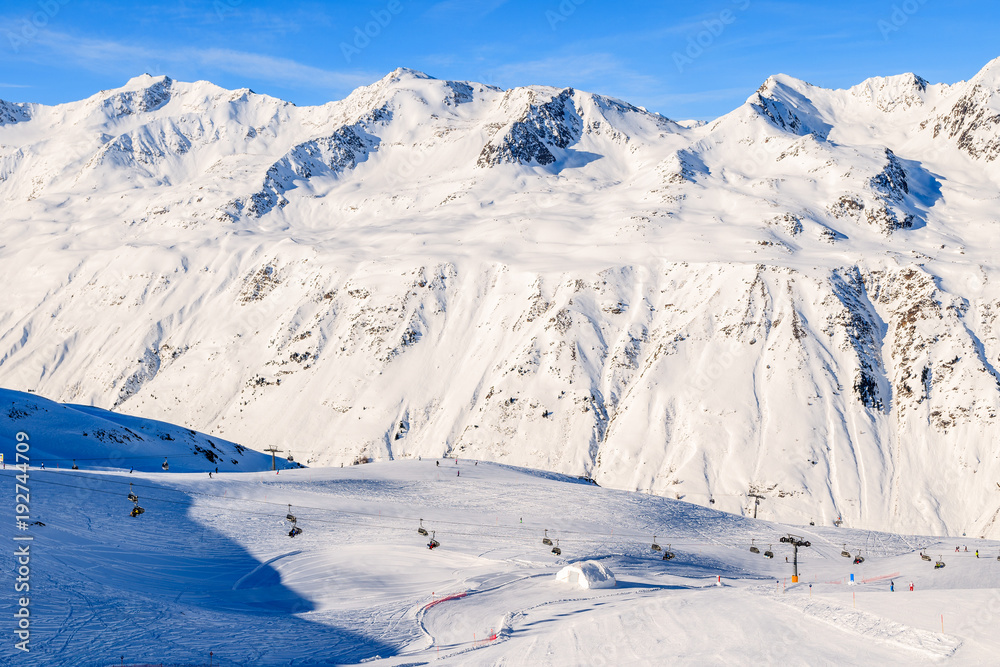 View of mountains and ski slopes in Obergurgl-Hochgurgl ski area on beautiful sunny winter day, Tirol, Austria