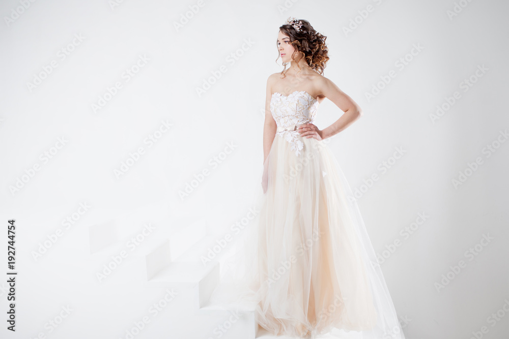 Concept of bride going towards future happiness. Beautiful girl in a wedding dress.