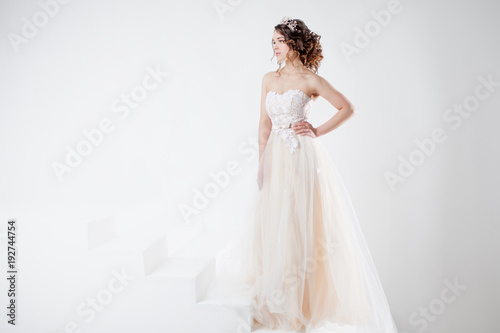 Concept of bride going towards future happiness. Beautiful girl in a wedding dress.