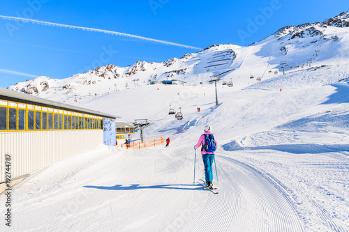 HOCHGURGL-OBERGURGL SKI AREA, AUSTRIA - JAN 30, 2018: Skier walking up to chairlift station in winter season, Hochgurgl-Obergurgl mountain resort, Austria.