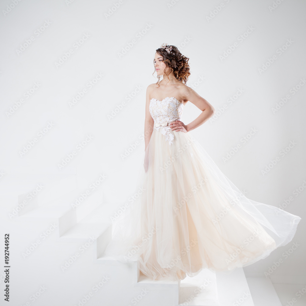 Concept of bride going towards future happiness. Beautiful girl in a wedding dress. Concept of bride going towards future happiness. Beautiful girl in a wedding dress.