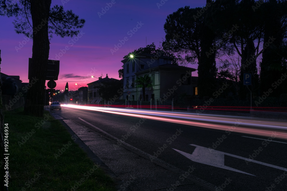 Car light trails in the sunset